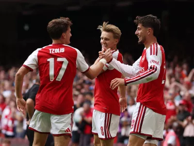 Soccer Football - FA Community Shield - Arsenal v Manchester City - Principality Stadium, Cardiff, Wales, Britain - August 16, 2026 Arsenal's Martin Odegaard celebrates scoring their third goal with Christos Tzolis and Kai Havertz REUTERS/Chris Radburn