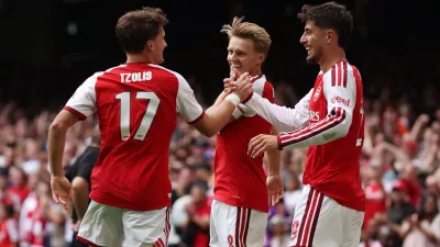 Soccer Football - FA Community Shield - Arsenal v Manchester City - Principality Stadium, Cardiff, Wales, Britain - August 16, 2026 Arsenal's Martin Odegaard celebrates scoring their third goal with Christos Tzolis and Kai Havertz REUTERS/Chris Radburn