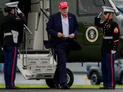 President Donald Trump walks to board Air Force One at Morristown Airport, Sunday, Aug. 16, 2026, in Morristown, N.J. (AP Photo/Julia Demaree Nikhinson)