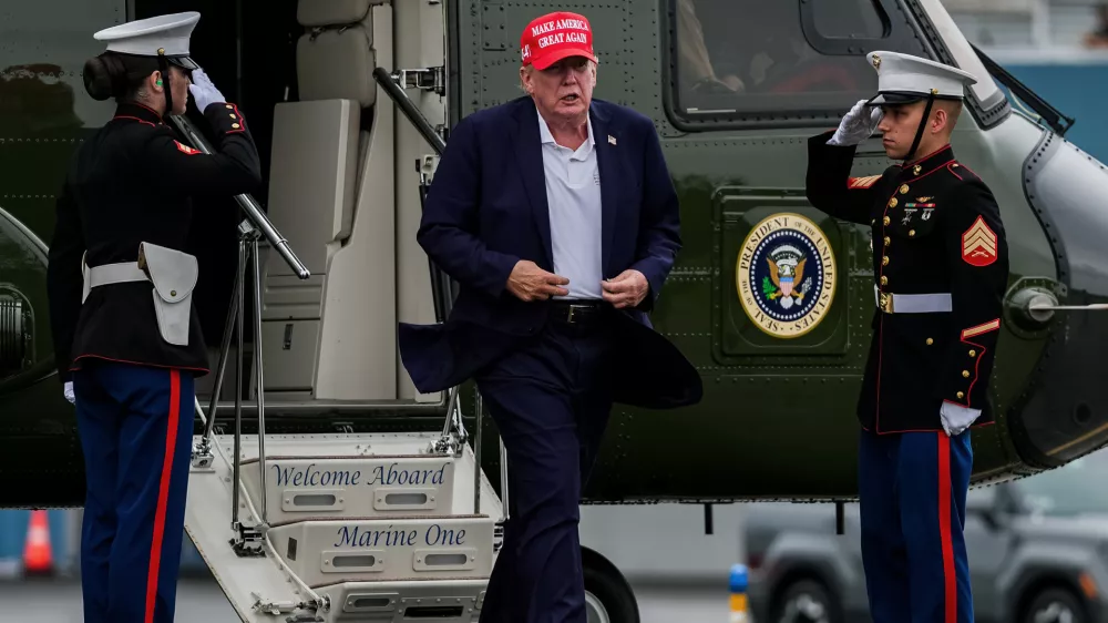 President Donald Trump walks to board Air Force One at Morristown Airport, Sunday, Aug. 16, 2026, in Morristown, N.J. (AP Photo/Julia Demaree Nikhinson)