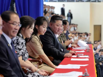 North Korean leader Kim Jong Un, accompanied by his daughter Kim Ju Ae and his wife Ri Sol Ju, attends a swimming and diving contest amid events marking the National Liberation Day, in Pyongyang, North Korea, August 16, 2026, in this photo released by North Korea's official Korean Central News Agency (KCNA) on August 17, 2026. KCNA via REUTERS  ATTENTION EDITORS - THIS IMAGE WAS PROVIDED BY A THIRD PARTY. REUTERS IS UNABLE TO INDEPENDENTLY VERIFY THIS IMAGE. NO THIRD PARTY SALES. SOUTH KOREA OUT. NO COMMERCIAL OR EDITORIAL SALES IN SOUTH KOREA.