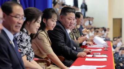 North Korean leader Kim Jong Un, accompanied by his daughter Kim Ju Ae and his wife Ri Sol Ju, attends a swimming and diving contest amid events marking the National Liberation Day, in Pyongyang, North Korea, August 16, 2026, in this photo released by North Korea's official Korean Central News Agency (KCNA) on August 17, 2026. KCNA via REUTERS  ATTENTION EDITORS - THIS IMAGE WAS PROVIDED BY A THIRD PARTY. REUTERS IS UNABLE TO INDEPENDENTLY VERIFY THIS IMAGE. NO THIRD PARTY SALES. SOUTH KOREA OUT. NO COMMERCIAL OR EDITORIAL SALES IN SOUTH KOREA.