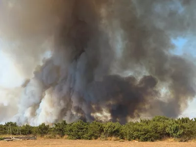 Smoke from a wildfire rises in Zadar, Croatia, August 14, 2026, in this screen grab obtained from a social media video. DOMINIK BRKLJACA/via REUTERS THIS IMAGE HAS BEEN SUPPLIED BY A THIRD PARTY. MANDATORY CREDIT. NO RESALES. NO ARCHIVES. Verification: -Buildings, terrain and roads that matched the archive and satellite imagery of the area -Coordinates: 44.162936, 15.227675 -Original file metadata -Croatian Fire Service reports of the fire