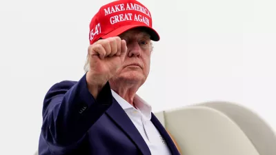President Donald Trump gestures while boarding Air Force One at Morristown Airport, Sunday, Aug. 16, 2026, in Morristown, N.J. (AP Photo/Julia Demaree Nikhinson)