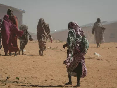 FILE PHOTO: Sudanese refugee women walk at the Tulum refugee camp, amid ongoing conflict in Sudan between the paramilitary Rapid Support Forces (RSF) and the Sudanese army, in Wadi Fira province, eastern Chad, November 30, 2025. REUTERS/Amr Abdallah Dalsh//File Photo