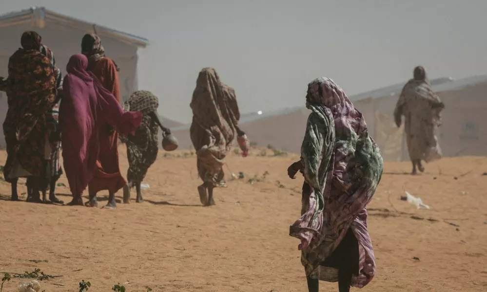 FILE PHOTO: Sudanese refugee women walk at the Tulum refugee camp, amid ongoing conflict in Sudan between the paramilitary Rapid Support Forces (RSF) and the Sudanese army, in Wadi Fira province, eastern Chad, November 30, 2025. REUTERS/Amr Abdallah Dalsh//File Photo