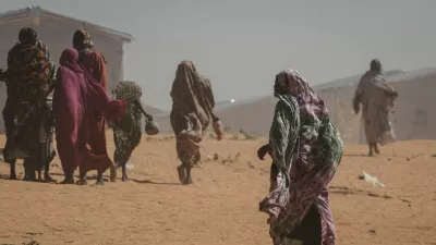 FILE PHOTO: Sudanese refugee women walk at the Tulum refugee camp, amid ongoing conflict in Sudan between the paramilitary Rapid Support Forces (RSF) and the Sudanese army, in Wadi Fira province, eastern Chad, November 30, 2025. REUTERS/Amr Abdallah Dalsh//File Photo