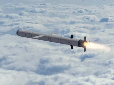 Russian cruise missile "Kalibr" flies above the clouds, smoke and fire from the nozzle of the missile. Concept: Russian missile attack, air alert