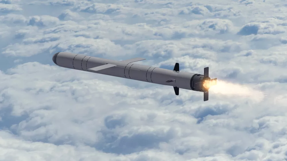 Russian cruise missile "Kalibr" flies above the clouds, smoke and fire from the nozzle of the missile. Concept: Russian missile attack, air alert