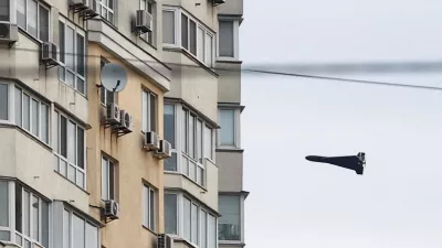 FILE PHOTO: A Russian Geran 2 kamikaze drone flies next to a building, amid Russia's attack on Ukraine, in Kyiv, Ukraine, April 16, 2026. REUTERS/Valentyn Ogirenko/File Photo