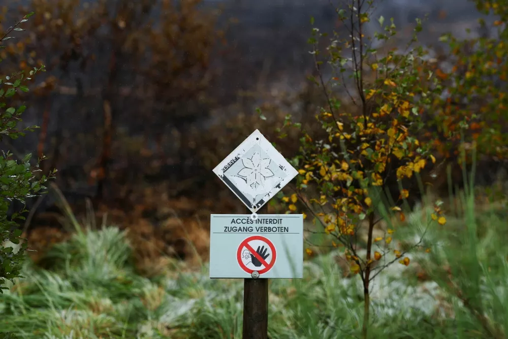 A "No Entry" sign at an area affected by a wildfire in Waimes, in the High Fens (Hautes Fagnes) region, Belgium, August 18, 2026. REUTERS/Yves Herman