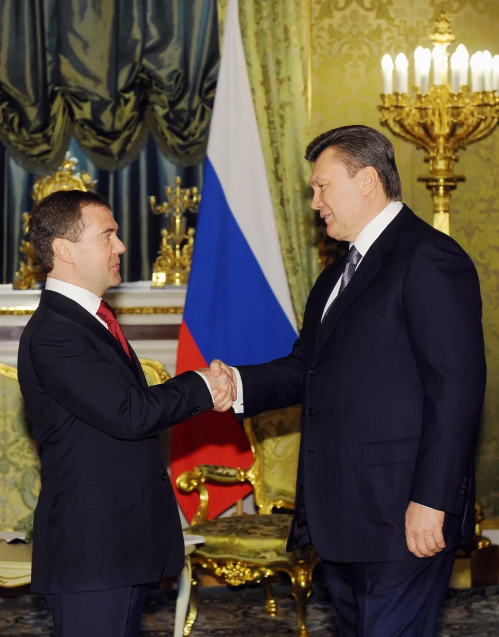 Russian President Dmitry Medvedev, left, shakes hands with Ukrainian counterpart Viktor Yanukovich, right, at the Kremlin in Moscow Friday, March 5, 2010. Yanukovych is in Moscow to meet with his Russian counterpart Dmitry Medvedev in hopes of getting Russia to cut gas prices for his country. Yanukovych, who was sworn in last week, is anxious to review the 2009 gas deal with Moscow that bound Ukraine to pay European gas prices, which are much higher than Ukraine previously paid. (AP Photo/ Natalia Kolosnikova, pool)