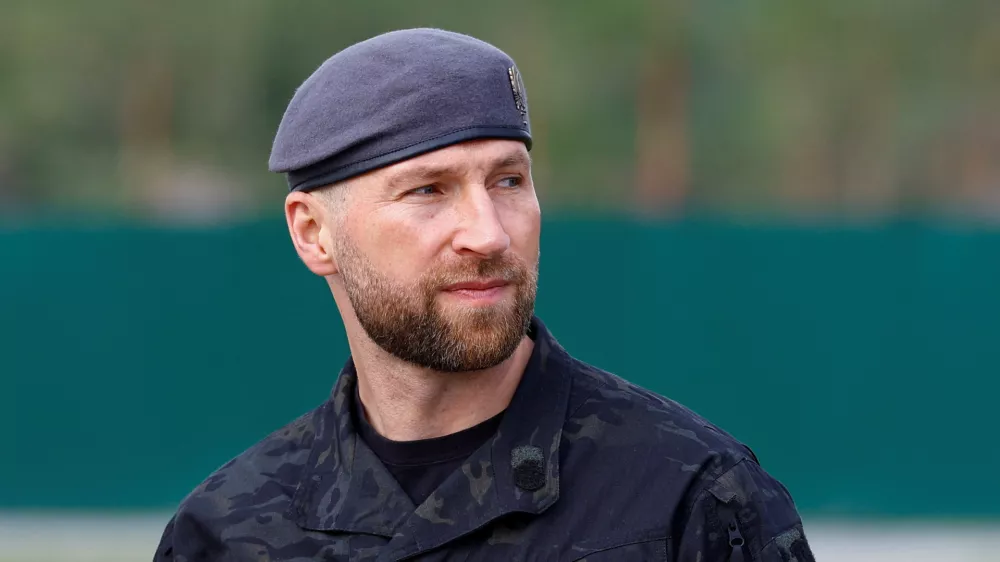 Ukrainian Acting Defence Minister Yevhenii Khmara before a reburial ceremony for Yevhen Konovalets, one of founders and leaders of the Organisation of Ukrainian Nationalists (OUN), at the National Military Memorial Cemetery outside of Kyiv, Ukraine, August 18, 2026. REUTERS/Valentyn Ogirenko