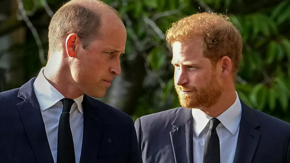 FILE - Britain's Prince William and Britain's Prince Harry walk beside each other after viewing the floral tributes for the late Queen Elizabeth II outside Windsor Castle, in Windsor, England on Sept. 10, 2022. (AP Photo/Martin Meissner, File)