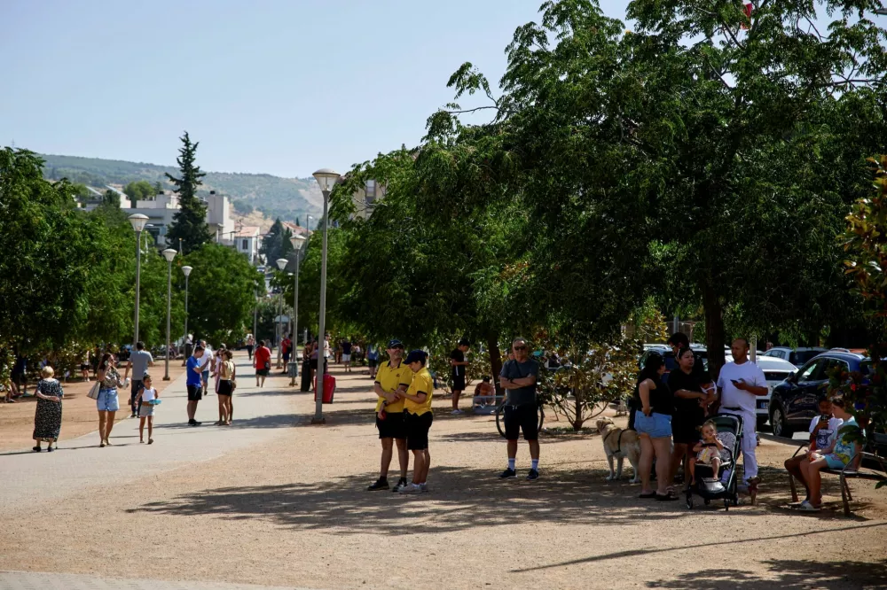 People wait in a park after being evacuated from affected areas in the aftermath of an earthquake that struck southern Spain, in Granada, Spain, August 18, 2026. REUTERS/Fermin Rodriguez