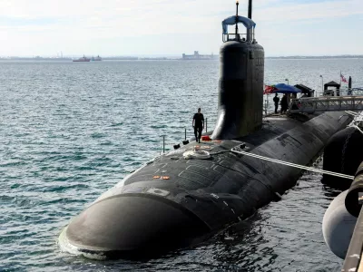 FILE PHOTO: A U.S. Navy officer walks on the Virginia-class fast-attack submarine USS Minnesota after the vessel docked at HMAS Stirling in Rockingham, Western Australia, February 26, 2025.  COLIN MURTY/Pool via REUTERS/File Photo