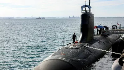 FILE PHOTO: A U.S. Navy officer walks on the Virginia-class fast-attack submarine USS Minnesota after the vessel docked at HMAS Stirling in Rockingham, Western Australia, February 26, 2025.  COLIN MURTY/Pool via REUTERS/File Photo