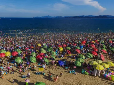 SHENZHEN, Aug. 2, 2015 People enjoy themselves at the Dameisha Beach Seashore Park in Shenzhen, south China's Guangdong Province, Aug. 2, 2015. As temperature rises in summer in Shenzhen, many tourists went to the seaside for swimming and sunbath.,Image: 254463175, License: Rights-managed, Restrictions:, Model Release: no 