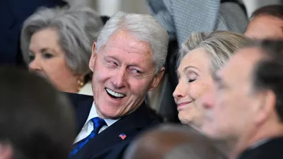 (L-R) Former US President Bill Clinton and former Secretary of State Hillary Clinton listen as President Donald Trump speaks after being sworn in as the 47th President in the US Capitol Rotunda in Washington, DC, on January 20, 2025.  SAUL LOEB/Pool via REUTERS