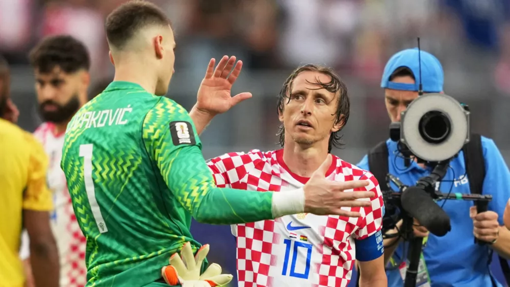 Soccer Football - FIFA World Cup 2026 - Group L - Croatia v Ghana - Philadelphia Stadium, Philadelphia, Pennsylvania, U.S. - June 27, 2026 Croatia's Luka Modric and Dominik Livakovic celebrate after the match IMAGN IMAGES via Reuters/James Lang