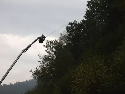 Firefighters work to extinguish a wildfire on a steep slope near Schramberg, Germany, Monday Aug. 17, 2026. (Philipp von Ditfurth/dpa via AP)