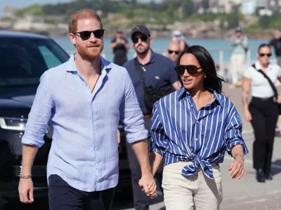FILE - Prince Harry, and Meghan, the Duke and Duchess of Sussex, arrive for an event, during a visit to Bondi Beach, Australia, April 17, 2026. (Jonathan Brady/Pool Photo via AP, File)