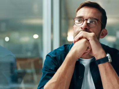 Reflection, thinking and business man with idea, creative insight or professional mindset. Planning, vision and serious worker with inspiration, problem solving and writer by glass in startup office