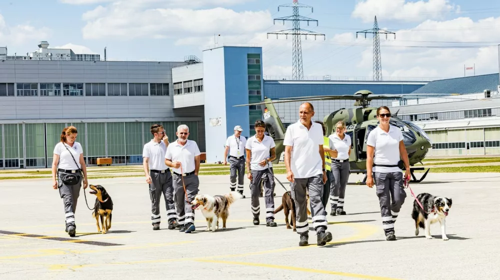 Rescue dogs are gently introduced to a H145 recue helicopeter at Donauw&ouml;rth, the German headquarters of Airbus Helicopters. //Life-saving sniffer dogs are seen overcoming their fear of rescue helicopters during vital training. Aircraft manufacturer Airbus helps canine units get used to the sound, vibrations and downwash of the rotors so they can travel to the areas where they are needed. The initially nervous dogs of the Nordschwaben District Association of the Bavarian Red Cross are introduced to a H145 aircraft at Donauw&ouml;rth, the German headquarters of Airbus Helicopters. They are then taken to the helicopter while the rotors are turning to get used to the sensations. Airbus said Friday (14/8): "The vibrations and downwash of the rotor unsettle the dogs. The closer they get, the more they cower. All that can help now are kind words from their human partner and a few treats from their pockets at the right moment. When the rescue teams go on search missions, there are usually helicopters in the air, flying over the area, which is why the dogs need to overcome their fear of them." Airbus said that five dogs took part &ndash; Miko, Odin, Bella, Mia and Hugo &ndash; with four overcoming their fear. It added: "But that's not a problem, since area search dogs don't normally fly with the helicopter. They are deployed in locations where the terrain can also be accessed by car."Photo released 19/08/2026,Image: 1125881857, License: Rights-managed, Restrictions: Editorial use, commercial use may require additional licenses. We don't use AI to make images which could be mistaken for news photos. AI use will be clearly indicated. Supplied on condition you ensure personal data is processed in compliance with UK GDPR, Model Release: no 