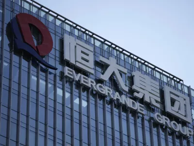 FILE - The Evergrande Group headquarters logo is seen in Shenzhen in southern China's Guangdong province on Sept. 24, 2021. A top executive of China Evergrande's electric vehicle company has been detained by police in the latest sign of trouble for the world's most heavily indebted property developer. (AP Photo/Ng Han Guan, File)