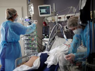 Medical staff members work in the Intensive Care Unit (ICU) where patients suffering from the coronavirus disease (COVID-19) are treated at the Melun-Senart hospital, near Paris, France, March 8, 2021. REUTERS/Benoit Tessier