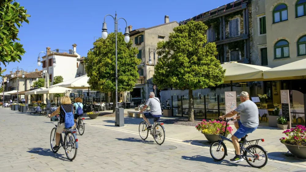 Cyclist, old town centre, Grado, Julian Friuli, Adriatic Sea, Italy,Image: 1035968141, License: Rights-managed, Restrictions:, Model Release: no 