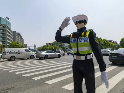 YONGKANG, CHINA - AUGUST 14: A robot traffic police officer advises riders to wear safety helmets at an intersection on August 14, 2026 in Yongkang, Jinhua, Zhejiang Province of China. Local authorities have launched a trial operation of robot traffic police to assist with road safety management. Copyright: xVCGx 111659918403,Image: 1122868997, License: Rights-managed, Restrictions: imago is entitled to issue a simple usage license at the time of provision. Personality and trademark rights as well as copyright laws regarding art-works shown must be observed. Commercial use at your own risk.;PUBLICATIONxNOTxINxCHN, Model Release: no 