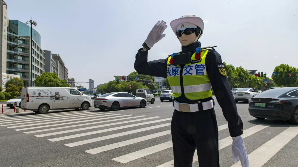 YONGKANG, CHINA - AUGUST 14: A robot traffic police officer advises riders to wear safety helmets at an intersection on August 14, 2026 in Yongkang, Jinhua, Zhejiang Province of China. Local authorities have launched a trial operation of robot traffic police to assist with road safety management. Copyright: xVCGx 111659918403,Image: 1122868997, License: Rights-managed, Restrictions: imago is entitled to issue a simple usage license at the time of provision. Personality and trademark rights as well as copyright laws regarding art-works shown must be observed. Commercial use at your own risk.;PUBLICATIONxNOTxINxCHN, Model Release: no 