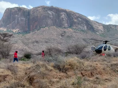 This photo provided by Kenya Red Cross shows Kenya Red Cross emergency response teams during a multi-agency rescue and recovery operation in response to a helicopter crash that killed tourists near Mt. Ololokwe in Samburu, Kenya, Wednesday, Aug. 19, 2026. (Kenya Red Cross via AP)