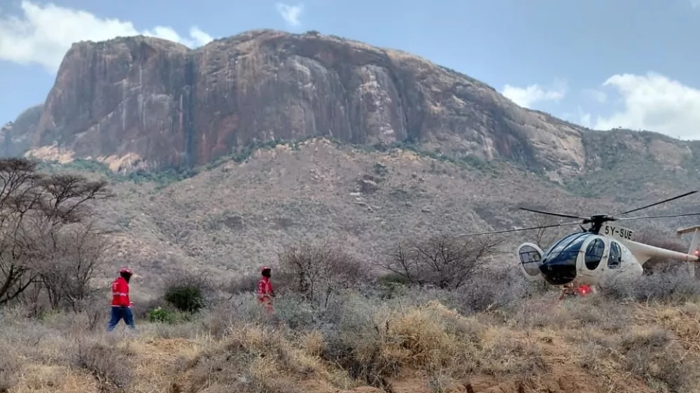 This photo provided by Kenya Red Cross shows Kenya Red Cross emergency response teams during a multi-agency rescue and recovery operation in response to a helicopter crash that killed tourists near Mt. Ololokwe in Samburu, Kenya, Wednesday, Aug. 19, 2026. (Kenya Red Cross via AP)