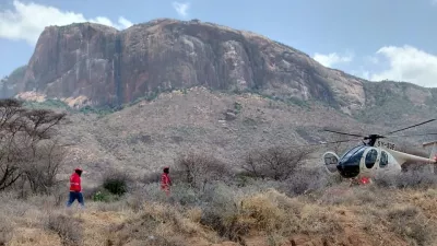 This photo provided by Kenya Red Cross shows Kenya Red Cross emergency response teams during a multi-agency rescue and recovery operation in response to a helicopter crash that killed tourists near Mt. Ololokwe in Samburu, Kenya, Wednesday, Aug. 19, 2026. (Kenya Red Cross via AP)
