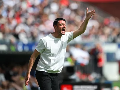 Eintracht Frankfurt's coach Albert Riera reacts on the touchline during a German Bundesliga soccer match between Eintracht Frankfurt and Hamburger SV in Frankfurt, Germany, Saturday, May 2, 2026. (Florian Wiegand/dpa via AP)