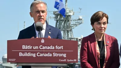 Canadian Prime Minister Mark Carney speaks as he announces a .3 billion contract for icebreakers at the Davie shipyard in Levis, Quebec on Monday, Aug. 24, 2026. Quebec Premier Christine Frechette, right, looks on. (Jacques Boissinot/The Canadian Press via AP)