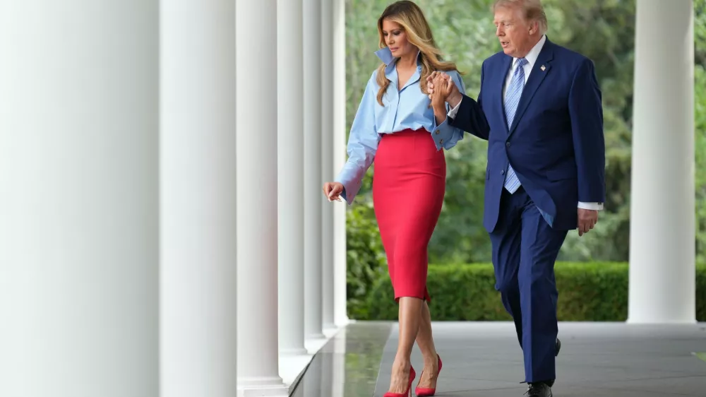 President Donald Trump, right, and first lady Melania Trump walk to attend an event in the Rose Garden of the White House, Thursday, Aug. 20, 2026, in Washington. (AP Photo/Jacquelyn Martin)