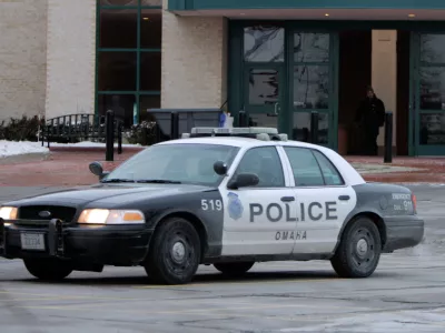 FILE - An Omaha police car drives on Dec. 8, 2007, in Omaha, Neb. (AP Photo/Jeff Roberson, File)