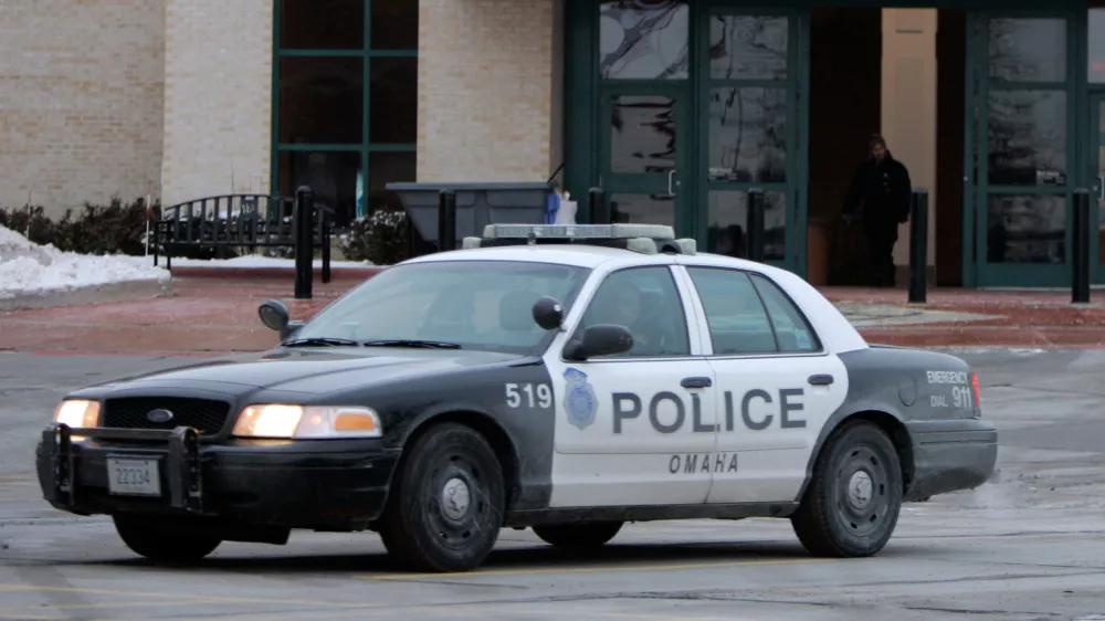 FILE - An Omaha police car drives on Dec. 8, 2007, in Omaha, Neb. (AP Photo/Jeff Roberson, File)