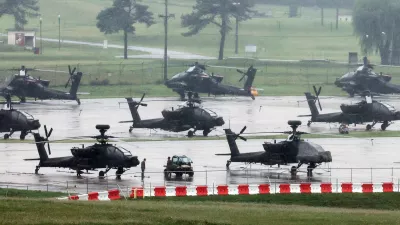 U.S. Army AH-64 Apache attack helicopters are parked at Camp Humphreys, on the final day of the annual U.S.-South Korea Ulchi Freedom Shield (UFS) joint military exercise, which was shortened by six days after U.S. President Donald Trump ordered a substantial reduction in U.S. participation, in Pyeongtaek, South Korea, August 21, 2026.  Yonhap via REUTERS ATTENTION EDITORS - THIS IMAGE HAS BEEN SUPPLIED BY A THIRD PARTY. NO RESALES. NO ARCHIVE. SOUTH KOREA OUT. NO COMMERCIAL OR EDITORIAL SALES IN SOUTH KOREA.