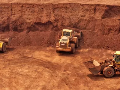 Loaders are filled with bauxite ore from Guinea at an ore yard in Yantai, Shandong, China, on June 18, 2026. (Photo by Costfoto/NurPhoto)NO USE FRANCE