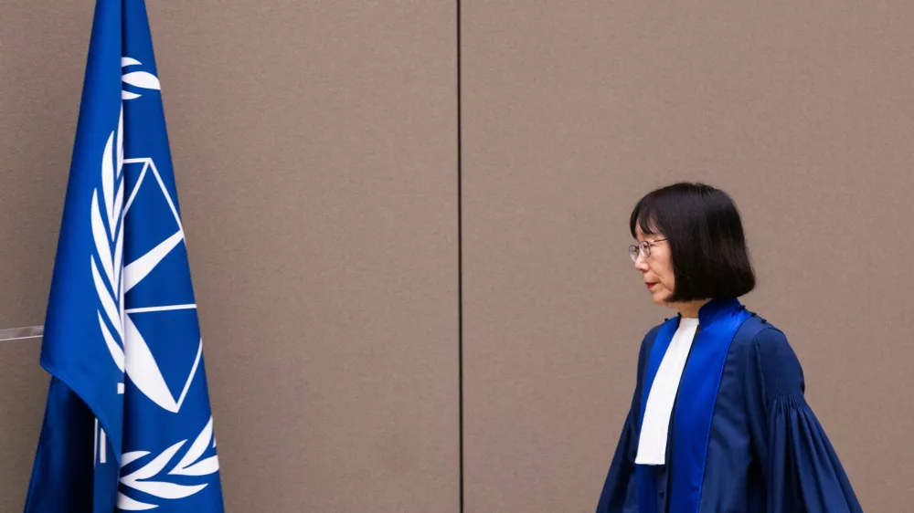 FILE - Judge Tomoko Akane walks before delivering the verdict in the Al Hassan case at the International Criminal Court in The Hague, Netherlands, Wednesday Nov. 20, 2024. (Eva Plevier/Pool Photo via AP, file)