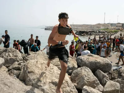 Heavy Migrant Movement at Ceuta Border CEUTA, SPAIN JULY 31, 2026: Migrants gather near the border crossing between Morocco and the Spanish enclave of Ceuta on July 31, 2026. Tens of thousands of migrants crossed into Ceuta from Morocco, while some continued to arrive and others voluntarily returned due to the precarious situation. Ceuta Spain Copyright: x xMarioxMoronx/xJNAxPressx,Image: 1120073086, License: Rights-managed, Restrictions: imago is entitled to issue a simple usage license at the time of provision. Personality and trademark rights as well as copyright laws regarding art-works shown must be observed. Commercial use at your own risk., Model Release: no 