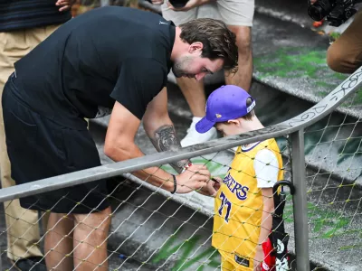 Luka Doncic signing a jersey of a young fanLos Angeles Lakers star Luka Doncic takes his teammates on a sightseeing boat tour of Ljubljana during the team's visit to the Slovenian capital. Doncic is hosting his Lakers teammates in his hometown as part of a four-day team gathering ahead of the new NBA season. The group toured the city by boat, taking in Ljubljana's historic city centre and landmarks along the Ljubljanica River.