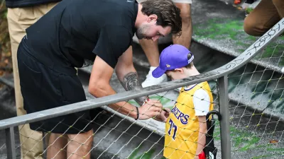 Luka Doncic signing a jersey of a young fanLos Angeles Lakers star Luka Doncic takes his teammates on a sightseeing boat tour of Ljubljana during the team's visit to the Slovenian capital. Doncic is hosting his Lakers teammates in his hometown as part of a four-day team gathering ahead of the new NBA season. The group toured the city by boat, taking in Ljubljana's historic city centre and landmarks along the Ljubljanica River.