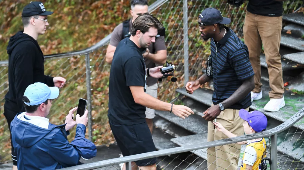 Luka Doncic signing a jersey of a young fanLos Angeles Lakers star Luka Doncic takes his teammates on a sightseeing boat tour of Ljubljana during the team's visit to the Slovenian capital. Doncic is hosting his Lakers teammates in his hometown as part of a four-day team gathering ahead of the new NBA season. The group toured the city by boat, taking in Ljubljana's historic city centre and landmarks along the Ljubljanica River.