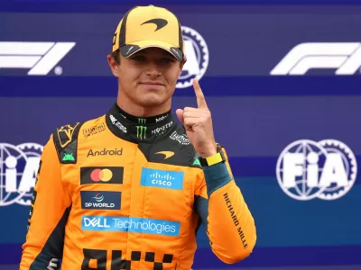 Formula One F1 - Dutch Grand Prix - Circuit Zandvoort, Zandvoort, Netherlands - August 22, 2026 McLaren's Lando Norris celebrates after qualifying in pole position REUTERS/Jakub Porzycki