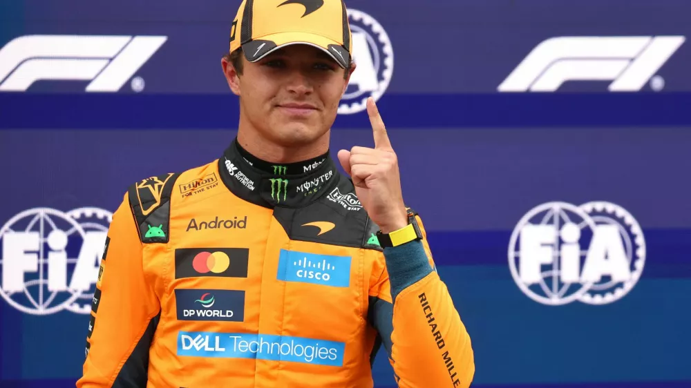 Formula One F1 - Dutch Grand Prix - Circuit Zandvoort, Zandvoort, Netherlands - August 22, 2026 McLaren's Lando Norris celebrates after qualifying in pole position REUTERS/Jakub Porzycki